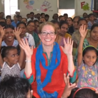 Teacher with students in Wolf Trap Institute for Early Learning Through The Arts at Manjul school in India.