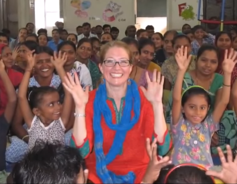 Teacher with students in Wolf Trap Institute for Early Learning Through The Arts at Manjul school in India.