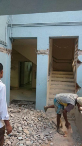 Entrance to Balavidyalaya school in India with severe damage from floods