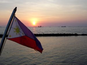 Philippines flag flying over calm water