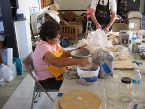 Students in Hopi School special projects art class make pottery