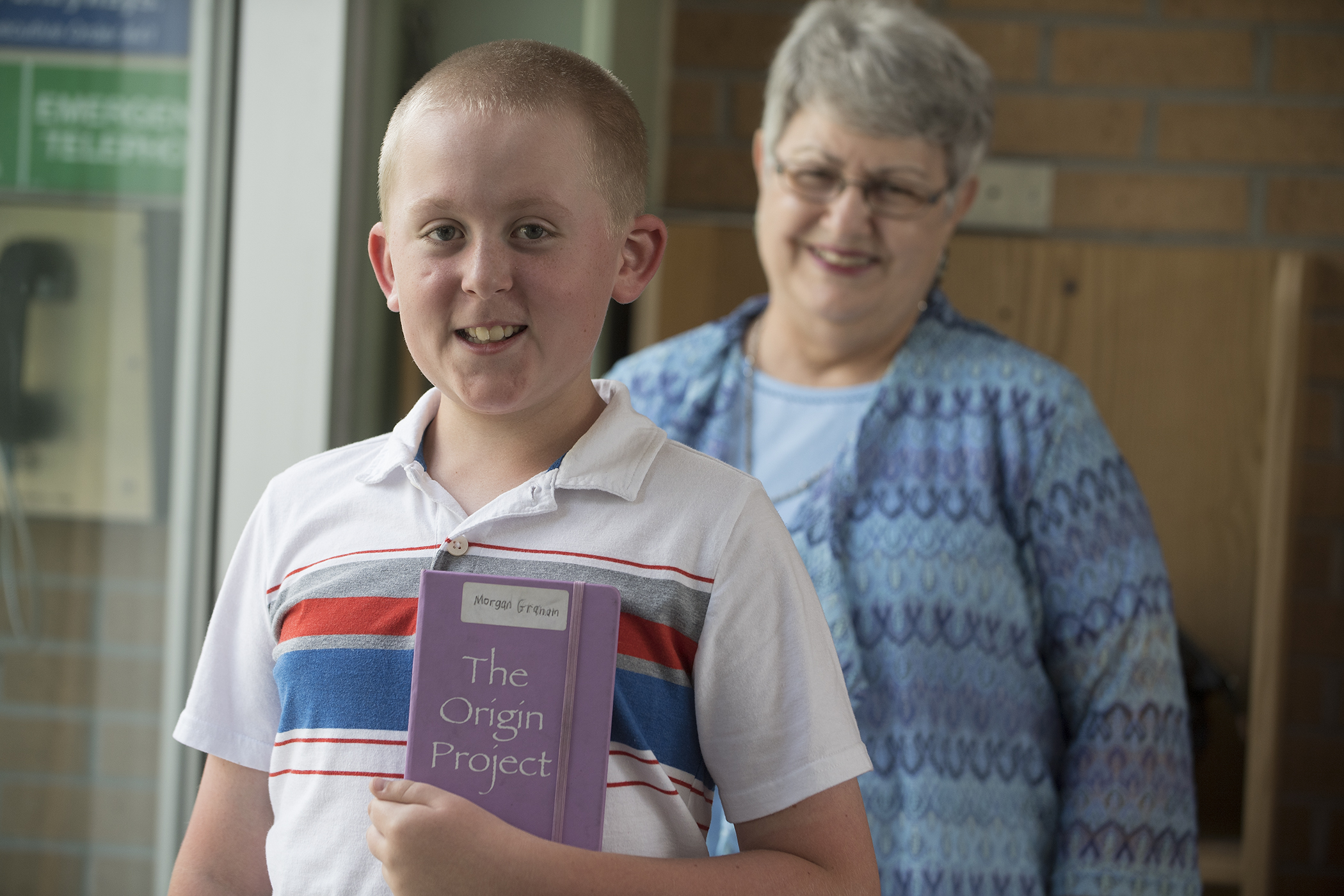 Student writer with his book