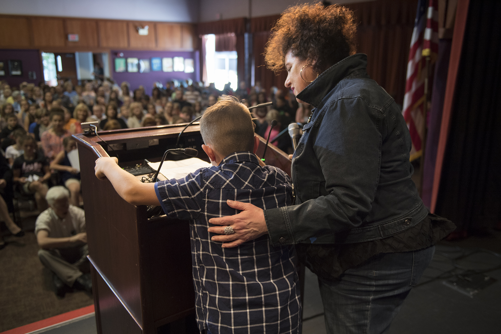 Trigiani assisting a student presenter at the event