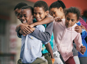 Children hug and smile