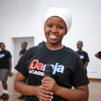 Daraja student holding a microphone